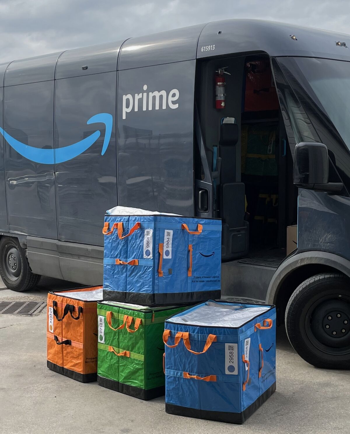 Amazon Prime delivery van with colored FBA removal totes staged at FlexPrep's Houston warehouse