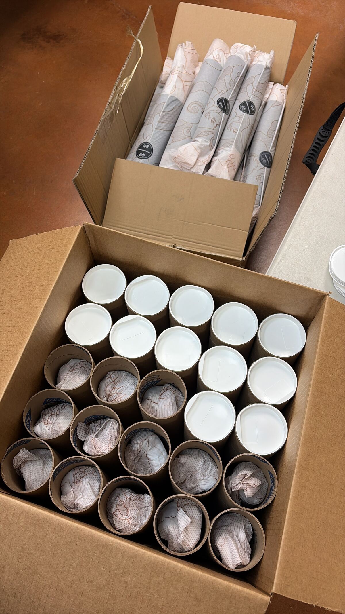 Product assembly and packing of rolled goods into branded tubes and cartons at FlexPrep
