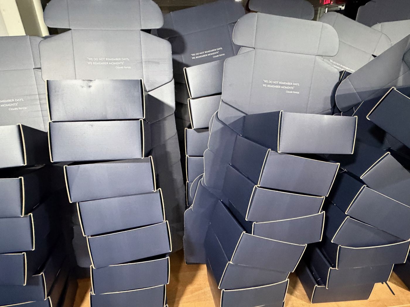 Custom mailer boxes staged for bundling and kitting